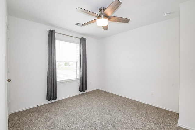 12324 Carib Crossing Ln, Conroe, TX 77304 - carpeted empty room with a smoke detector, ceiling fan, and baseboards