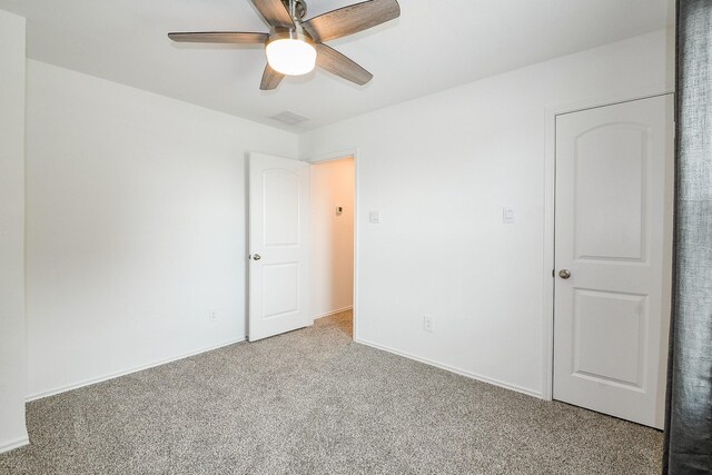 12324 Carib Crossing Ln, Conroe, TX 77304 - unfurnished bedroom featuring carpet floors, ceiling fan, and baseboards