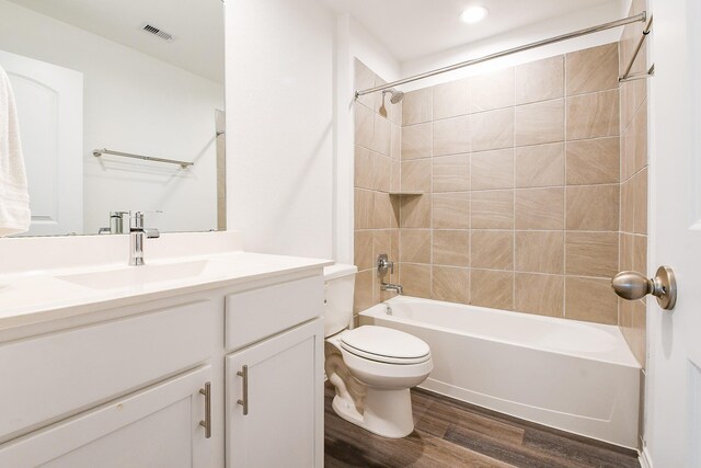 12324 Carib Crossing Ln, Conroe, TX 77304 - full bathroom featuring wood finished floors, vanity, toilet, bathtub / shower combination, and recessed lighting