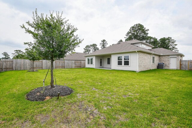 12324 Carib Crossing Ln, Conroe, TX 77304 - view of yard with central AC unit