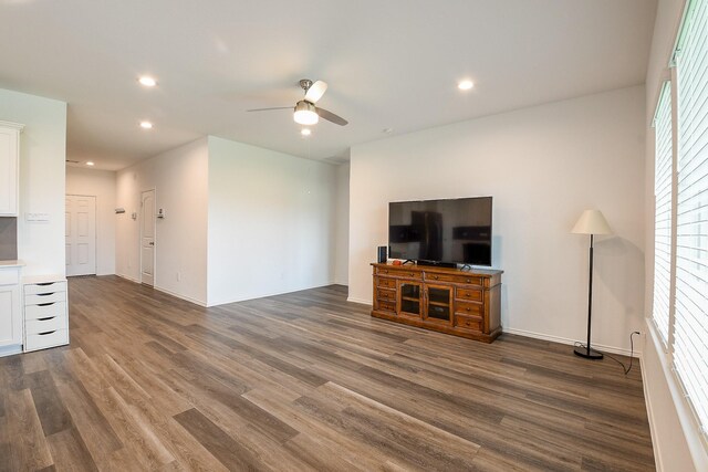 12324 Carib Crossing Ln, Conroe, TX 77304 - unfurnished living room with ceiling fan, dark wood-type flooring, recessed lighting, and baseboards