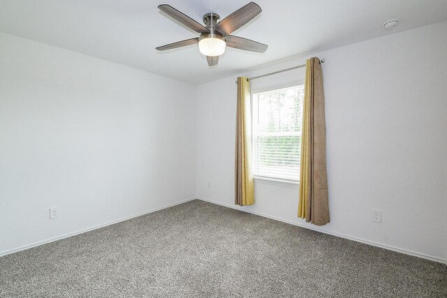 12324 Carib Crossing Ln, Conroe, TX 77304 - spare room with carpet floors, a ceiling fan, and baseboards