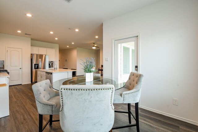 12324 Carib Crossing Ln, Conroe, TX 77304 - dining space with dark wood-style flooring, recessed lighting, ceiling fan, and baseboards