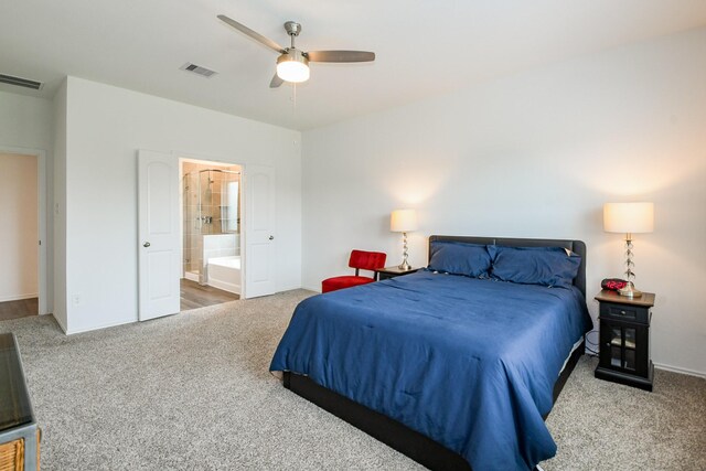 12324 Carib Crossing Ln, Conroe, TX 77304 - bedroom with carpet floors, baseboards, connected bathroom, and ceiling fan