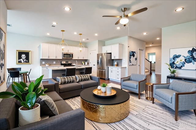 12324 Carib Crossing Ln, Conroe, TX 77304 - living area featuring ceiling fan, recessed lighting, baseboards, and stairs
