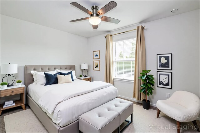 12324 Carib Crossing Ln, Conroe, TX 77304 - bedroom with light carpet, baseboards, and ceiling fan