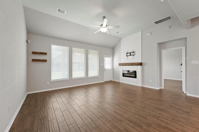 4430 Lone Alcove Dr, Spring, TX 77386 - unfurnished living room with ceiling fan, lofted ceiling, dark wood finished floors, baseboards, and a fireplace