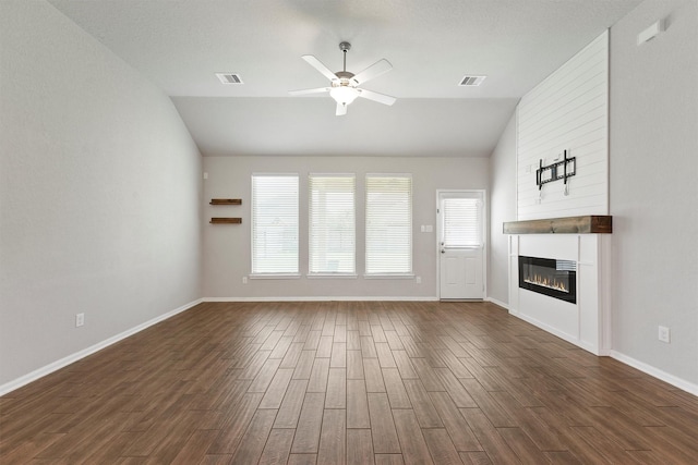 4430 Lone Alcove Dr, Spring, TX 77386 - unfurnished living room featuring lofted ceiling, a ceiling fan, dark wood finished floors, a large fireplace, and baseboards