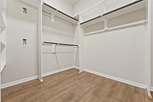 4430 Lone Alcove Dr, Spring, TX 77386 - walk in closet featuring wood finished floors