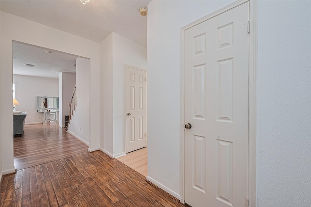 211 Aberdeen St, Stafford, TX 77477 - corridor featuring wood finished floors and stairs