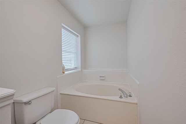 211 Aberdeen St, Stafford, TX 77477 - bathroom with a bath and tile patterned floors