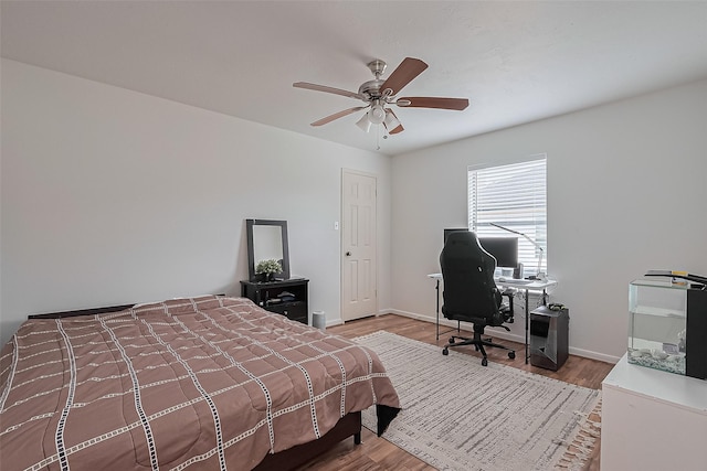 211 Aberdeen St, Stafford, TX 77477 - bedroom featuring wood finished floors, a desk, and ceiling fan