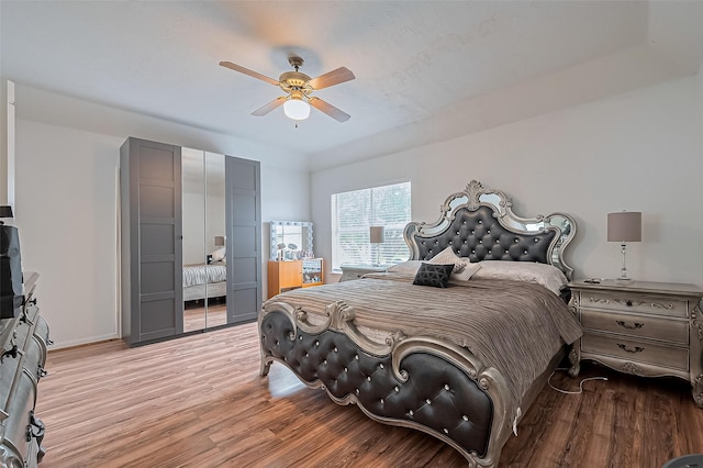 211 Aberdeen St, Stafford, TX 77477 - bedroom with light wood finished floors and ceiling fan