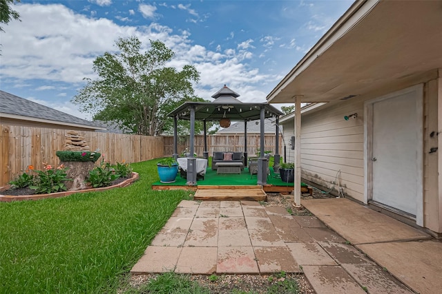 211 Aberdeen St, Stafford, TX 77477 - fenced backyard featuring a gazebo, outdoor lounge area, a wooden deck, and a patio