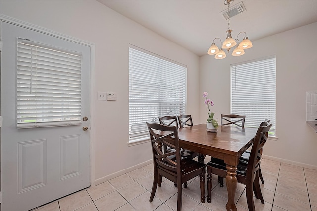 211 Aberdeen St, Stafford, TX 77477 - dining room featuring a chandelier, healthy amount of natural light, and light tile patterned flooring