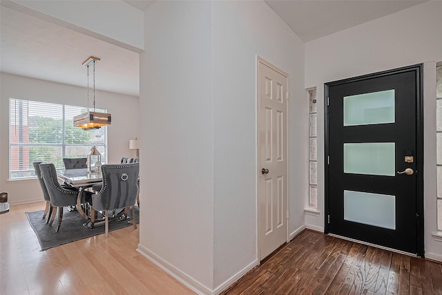 211 Aberdeen St, Stafford, TX 77477 - entrance foyer featuring wood-type flooring and a chandelier