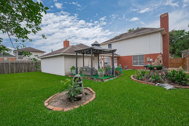 211 Aberdeen St, Stafford, TX 77477 - back of property with a gazebo, a fenced backyard, brick siding, and a patio area