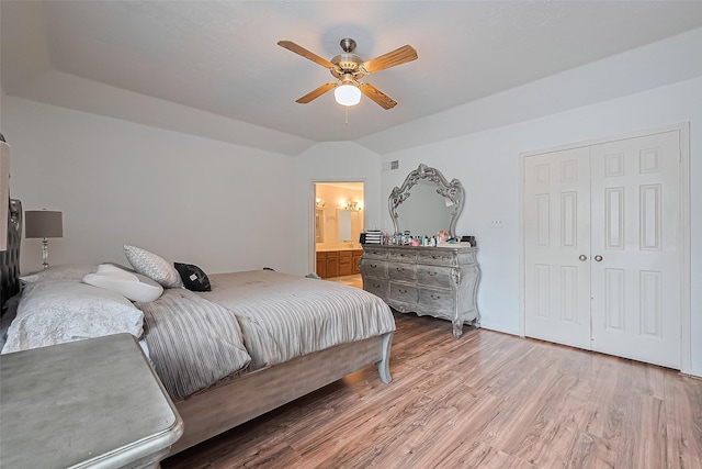 211 Aberdeen St, Stafford, TX 77477 - bedroom with light wood-style floors, lofted ceiling, a ceiling fan, and a closet