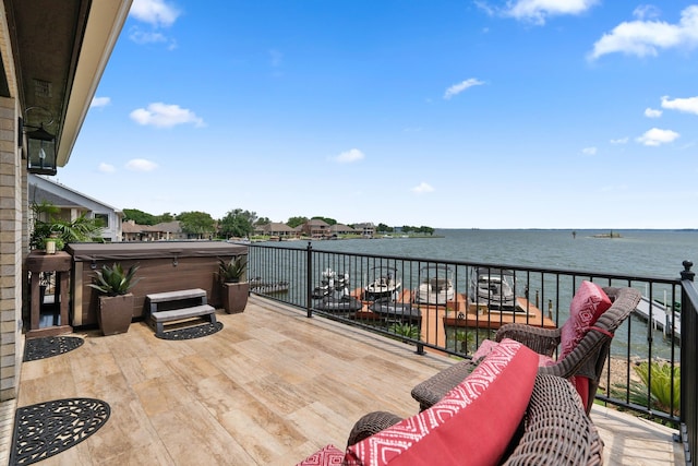 2117 Gunwale Cir, Willis, TX 77318 - view of patio with a hot tub and a water view