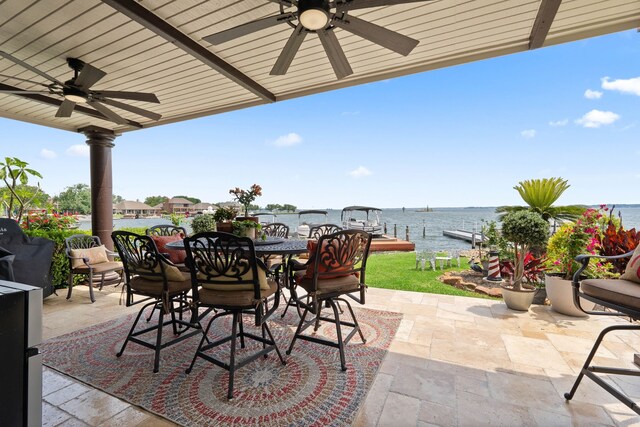2117 Gunwale Cir, Willis, TX 77318 - view of patio / terrace featuring a ceiling fan, outdoor dining space, and a water view