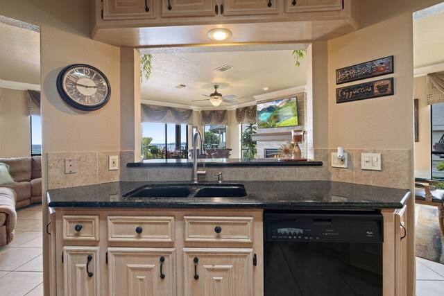 2117 Gunwale Cir, Willis, TX 77318 - kitchen featuring dishwasher, open floor plan, a sink, light tile patterned floors, and a textured wall