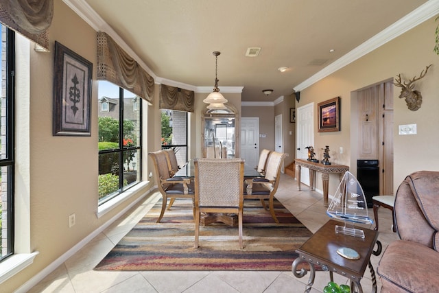 2117 Gunwale Cir, Willis, TX 77318 - dining room with light tile patterned flooring, crown molding, and baseboards