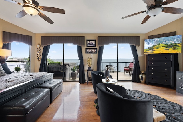 2117 Gunwale Cir, Willis, TX 77318 - living room featuring lofted ceiling, a ceiling fan, healthy amount of natural light, and light wood-style flooring