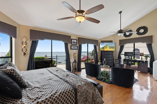 2117 Gunwale Cir, Willis, TX 77318 - bedroom featuring access to exterior, light wood finished floors, a desk, vaulted ceiling, and a ceiling fan