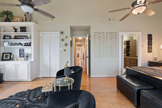 2117 Gunwale Cir, Willis, TX 77318 - living area with a ceiling fan, light wood-type flooring, and baseboards
