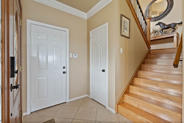 2117 Gunwale Cir, Willis, TX 77318 - foyer with ornamental molding, stairs, light tile patterned floors, and baseboards