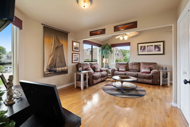 2117 Gunwale Cir, Willis, TX 77318 - living area featuring wood finished floors, baseboards, and a ceiling fan