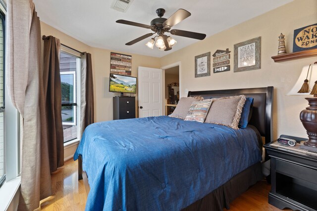 2117 Gunwale Cir, Willis, TX 77318 - bedroom with wood finished floors and ceiling fan