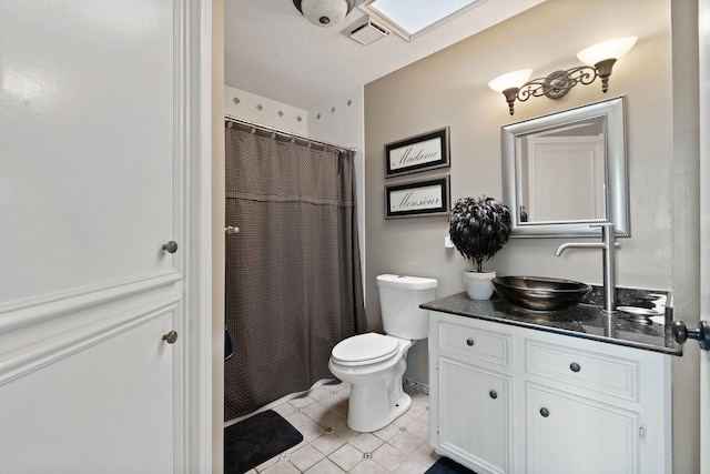 2117 Gunwale Cir, Willis, TX 77318 - bathroom featuring toilet, vanity, tile patterned floors, and a shower with shower curtain