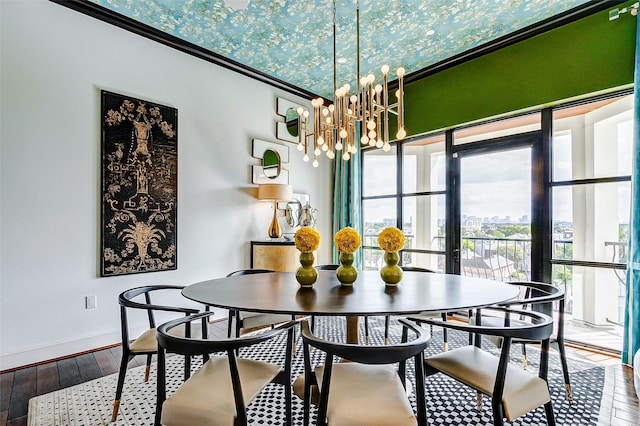 2221 Welch St Unit 601, Houston, TX 77019 - dining space with hardwood / wood-style floors, a chandelier, and baseboards