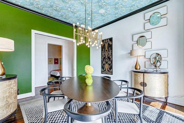 2221 Welch St Unit 601, Houston, TX 77019 - dining room featuring a chandelier, baseboards, and wood finished floors
