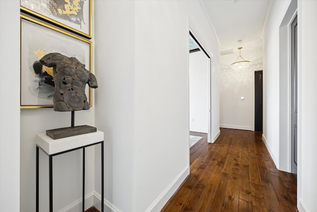 2221 Welch St Unit 601, Houston, TX 77019 - hallway with wood-type flooring, baseboards, and a chandelier