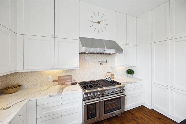 2221 Welch St Unit 601, Houston, TX 77019 - kitchen featuring range with two ovens, exhaust hood, and white cabinets