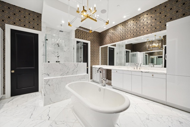 2221 Welch St Unit 601, Houston, TX 77019 - bathroom with a chandelier, a marble finish shower, a freestanding bath, vanity, and recessed lighting