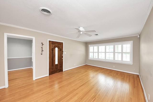 1831 Watercrest Dr, Houston, TX 77008 - foyer entrance featuring a ceiling fan, ornamental molding, light wood-style floors, and baseboards