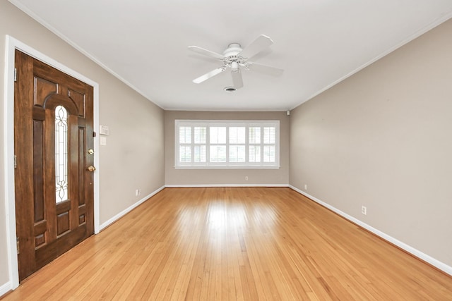1831 Watercrest Dr, Houston, TX 77008 - foyer with crown molding, ceiling fan, light wood finished floors, and baseboards