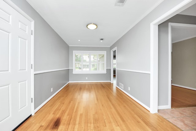 1831 Watercrest Dr, Houston, TX 77008 - spare room featuring wood finished floors, crown molding, and baseboards