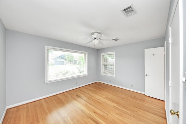 1831 Watercrest Dr, Houston, TX 77008 - spare room with baseboards, a ceiling fan, and light wood-style flooring