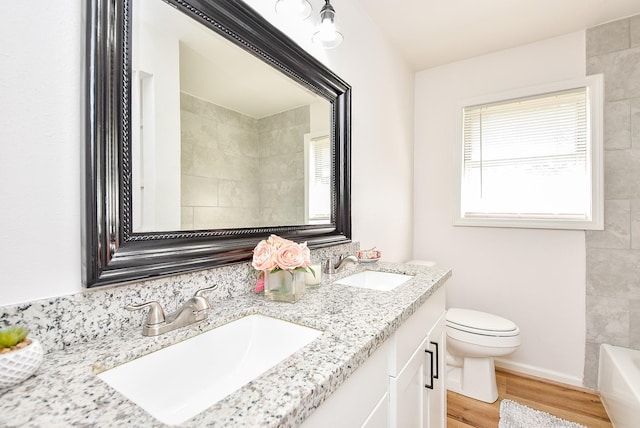 2751 Piper Rd, Pearland, TX 77584 - full bath with double vanity, wood finished floors, a tub to relax in, toilet, and a shower