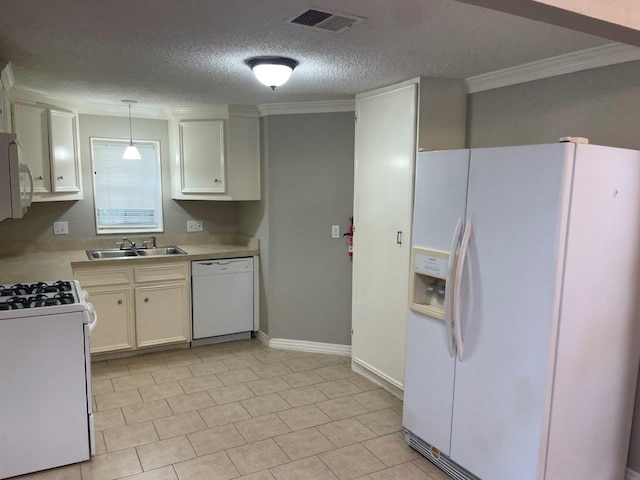 5311 Gano St, Houston, TX 77009 - kitchen with white appliances, a sink, light countertops, a textured ceiling, and crown molding