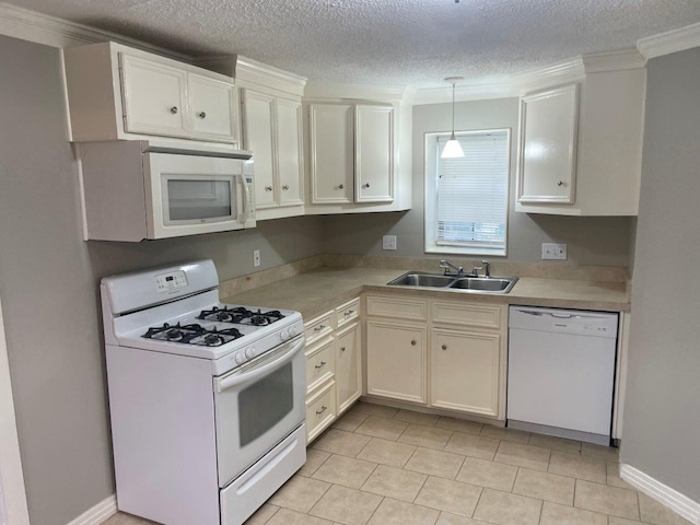 5311 Gano St, Houston, TX 77009 - kitchen with white appliances, a sink, light countertops, a textured ceiling, and hanging light fixtures