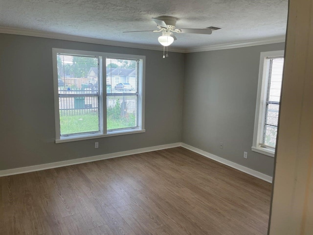 5311 Gano St, Houston, TX 77009 - unfurnished room featuring plenty of natural light, wood finished floors, crown molding, a textured ceiling, and a ceiling fan