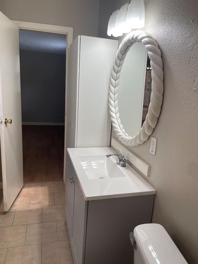 5311 Gano St, Houston, TX 77009 - bathroom with toilet, vanity, and tile patterned flooring