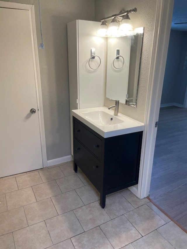5311 Gano St, Houston, TX 77009 - bathroom featuring vanity, tile patterned flooring, and baseboards