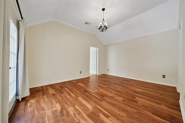 3006 Nickleby Ct, Katy, TX 77494 - empty room featuring a chandelier, vaulted ceiling, plenty of natural light, crown molding, and light wood-style flooring