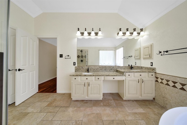 3006 Nickleby Ct, Katy, TX 77494 - full bathroom with ornamental molding, vaulted ceiling, a tile shower, double vanity, and stone tile flooring